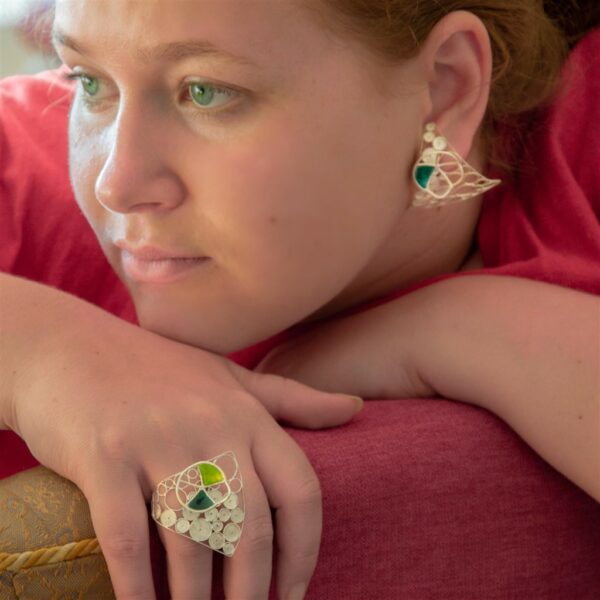 Signature Filigree and Enamel Ring worn with matching earrings