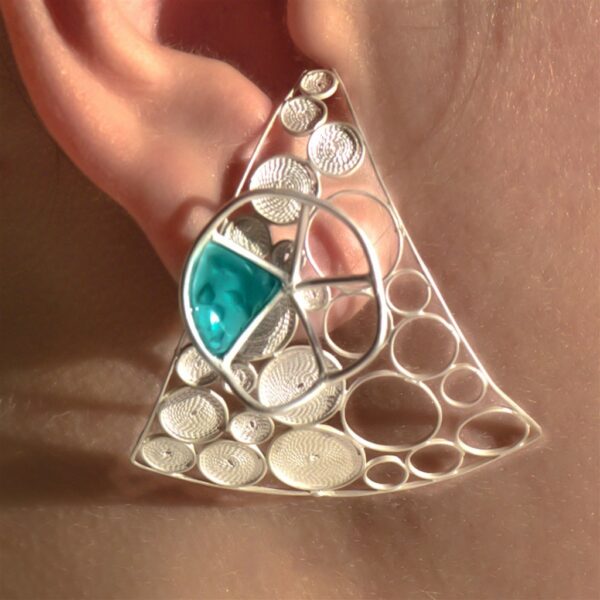 Signature silver filigree and enamel earring worn