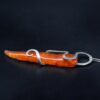 recycled silver and tapered orange glass pendant on its side