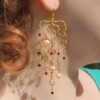 Dangling Designer Gold Waterfall Earrings worn