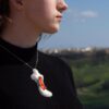 Nadur Hill Malta silver and sunset glass pendant worn side