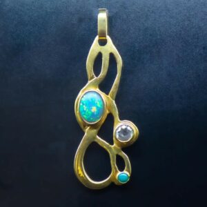 Bespoke gold and opal pendant hanging
