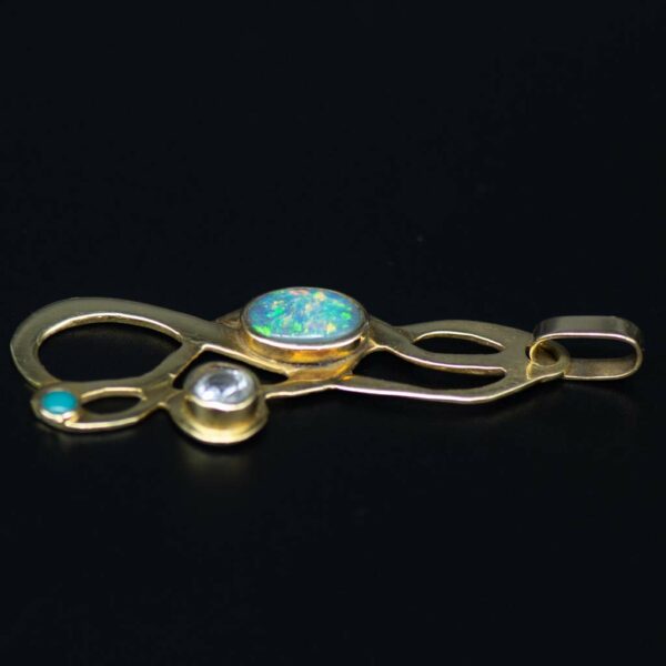 Bespoke gold and opal pendant side