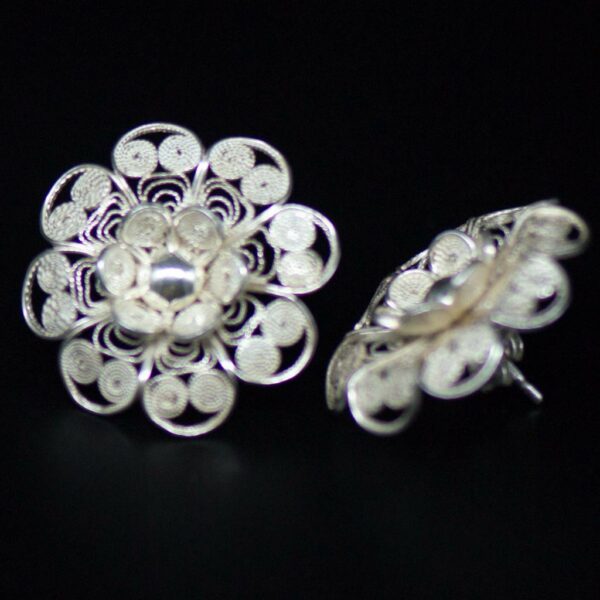 Elegant floral silver filigree bridal earrings at an angle