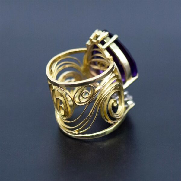 Redesigned heirloom amethyst diamond and filigree gold ring angled