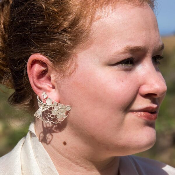 stylish layered silver filigree wedding earrings worn