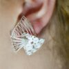 Stylish layered silver filigree wedding earrings worn
