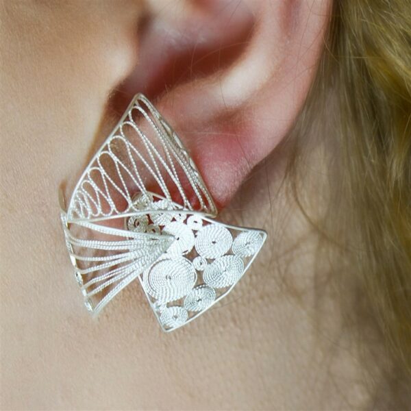 Stylish layered silver filigree wedding earrings worn