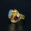 Sustainable gold filigree opal and garnet ring side