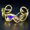 Designer gold bracelet with opal and tourmaline front
