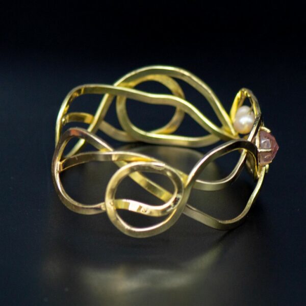 Designer gold bracelet with opal and tourmaline side