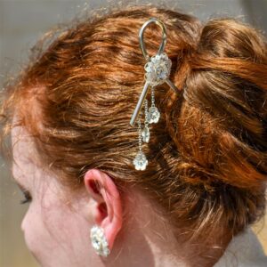 Silver filigree wedding hair pin worn side view