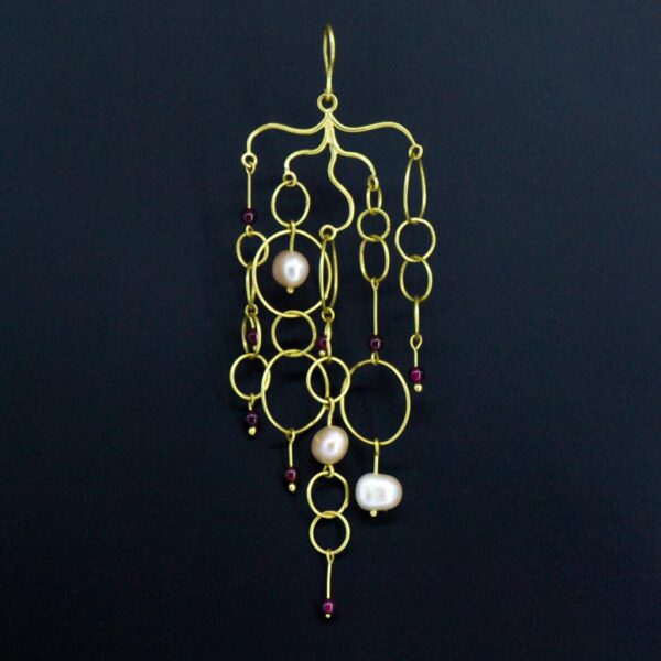 Dangling designer gold waterfall earrings single earring hanging