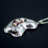 Elegant Silver Contour Pearl Pendant side