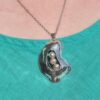 Elegant Silver Contour Pearl Pendant worn